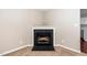Close up of the fireplace in the living room with a detailed mantle at 216 Climbing Ivy Ct, Cary, NC 27511