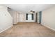 Inviting living room with ceiling fan, window seat, and neutral decor at 216 Climbing Ivy Ct, Cary, NC 27511