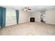 Spacious living room featuring a cozy fireplace and large window with view at 216 Climbing Ivy Ct, Cary, NC 27511
