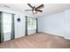 Bright, airy main bedroom featuring a ceiling fan and large windows at 216 Climbing Ivy Ct, Cary, NC 27511