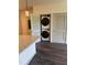 Modern kitchen with a stacked washer and dryer unit at 2418 Gathering Square Ct, Fuquay Varina, NC 27526