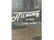 Close-up view of J's Creamery storefront window signage for Ice Cream, Coffee, and Pastries at 2418 Gathering Square Ct, Fuquay Varina, NC 27526