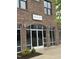 Modern brick building featuring Khao Sen Thai and Tea with glass door entry and large windows at 2418 Gathering Square Ct, Fuquay Varina, NC 27526