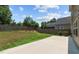 Spacious backyard featuring a privacy fence, concrete patio, and plenty of green space for outdoor activities at 2501 Macedonia Pine Dr, Raleigh, NC 27616