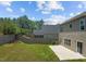 Large backyard featuring a patio, privacy fence, and ample green space for outdoor enjoyment at 2501 Macedonia Pine Dr, Raleigh, NC 27616