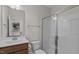 Bathroom featuring a walk-in shower with glass door, a vanity with ample storage, and modern fixtures at 2501 Macedonia Pine Dr, Raleigh, NC 27616