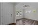 Bright foyer with hardwood floors, a ceiling fan, and views of the neighborhood at 2501 Macedonia Pine Dr, Raleigh, NC 27616