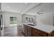 Modern kitchen featuring a center island, stainless steel appliances, and sliding glass doors to the backyard at 2501 Macedonia Pine Dr, Raleigh, NC 27616