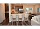 Eat-in kitchen boasting stainless appliances, a tile backsplash, breakfast bar, and an adjacent dining area at 2501 Macedonia Pine Dr, Raleigh, NC 27616