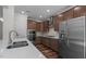 Spacious kitchen with stainless steel appliances, quartz countertops, and hardwood flooring at 2501 Macedonia Pine Dr, Raleigh, NC 27616