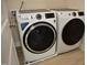 Modern laundry room with GE washer and dryer, offering efficient laundry solutions at 2501 Macedonia Pine Dr, Raleigh, NC 27616