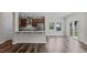 Open-concept living room adjacent to a modern kitchen with stainless steel appliances at 2501 Macedonia Pine Dr, Raleigh, NC 27616