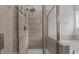 Detailed view of luxury shower showcasing tile and a sleek glass door at 2501 Macedonia Pine Dr, Raleigh, NC 27616