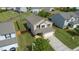 Aerial view showcasing the home's exterior, spacious yard, and the surrounding residential neighborhood at 2527 Girvan Dr, Fuquay Varina, NC 27526
