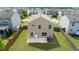 Aerial view of the rear exterior with a fenced yard and patio at 2527 Girvan Dr, Fuquay Varina, NC 27526