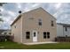 Back of home featuring vinyl siding, a door, and windows with a patio perfect for relaxation at 2527 Girvan Dr, Fuquay Varina, NC 27526