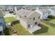 Aerial view of backyard featuring house, lawn, garden, and patio area at 2527 Girvan Dr, Fuquay Varina, NC 27526