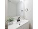 Modern bathroom features a stylish vanity, sink, and updated fixtures at 2527 Girvan Dr, Fuquay Varina, NC 27526
