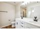 Bathroom featuring a double sink vanity with black fixtures and wood-look flooring at 2527 Girvan Dr, Fuquay Varina, NC 27526
