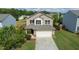 Two-story home with a two-car garage and manicured lawn in a residential neighborhood at 2527 Girvan Dr, Fuquay Varina, NC 27526