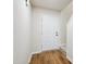 View of the foyer with light walls, dark wood flooring, and staircase to the second floor at 2527 Girvan Dr, Fuquay Varina, NC 27526