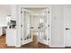 View of open french doors that lead to a room beyond the kitchen at 2527 Girvan Dr, Fuquay Varina, NC 27526