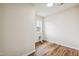 Laundry room with wood-look floors and natural light from the window at 2527 Girvan Dr, Fuquay Varina, NC 27526