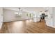 Open-concept living space featuring lovely wood floors and ample natural light at 2527 Girvan Dr, Fuquay Varina, NC 27526