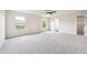 Large main bedroom featuring carpeted floors, lots of natural light, and a ceiling fan at 2527 Girvan Dr, Fuquay Varina, NC 27526