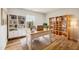 Bright home office space featuring hardwood floors and built-in shelving at 2527 Girvan Dr, Fuquay Varina, NC 27526