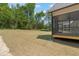 View of the backyard and the screened-in porch at 260 Pilot Ridge Rd, Zebulon, NC 27597