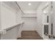 Walk-in closet with wood floors and shelving for optimal storage and organization at 260 Pilot Ridge Rd, Zebulon, NC 27597