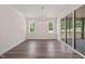 Bright dining area featuring wood floors, a stylish chandelier, and sliding doors to the outdoor space at 260 Pilot Ridge Rd, Zebulon, NC 27597