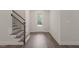 Bright foyer with luxury vinyl plank flooring and a staircase provides a welcoming entrance at 260 Pilot Ridge Rd, Zebulon, NC 27597
