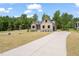 Charming home with a manicured lawn and a long concrete driveway at 260 Pilot Ridge Rd, Zebulon, NC 27597