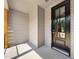 Covered front porch featuring a black front door and plenty of sunlight at 260 Pilot Ridge Rd, Zebulon, NC 27597