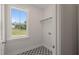 Functional laundry room with patterned flooring and a large window offering bright views at 260 Pilot Ridge Rd, Zebulon, NC 27597