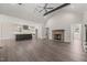 Bright living room with an open floor plan to the kitchen featuring an island and stainless appliances at 260 Pilot Ridge Rd, Zebulon, NC 27597