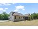 Home's rear exterior featuring a screened porch, newly installed lawn and an attached garage at 260 Pilot Ridge Rd, Zebulon, NC 27597
