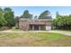Spacious backyard featuring a multi-level deck and driveway at 2606 Newquay St, Durham, NC 27705