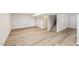Basement with luxury vinyl plank floors and access to stairs at 2606 Newquay St, Durham, NC 27705