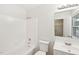 Bathroom with a shower-tub combo and a bright vanity at 2606 Newquay St, Durham, NC 27705