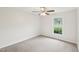 Bright bedroom with a ceiling fan and a window overlooking the outdoors at 2606 Newquay St, Durham, NC 27705