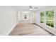 Bright dining area with hardwood floors and large windows showcasing the outdoor view at 2606 Newquay St, Durham, NC 27705