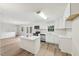 Modern kitchen with white cabinets, stainless steel appliances, and a kitchen island at 2606 Newquay St, Durham, NC 27705