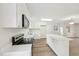 Bright kitchen featuring white cabinetry, stainless steel appliances, and quartz countertops at 2606 Newquay St, Durham, NC 27705