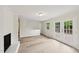 Open living room with hardwood floors, natural light, and access to the deck at 2606 Newquay St, Durham, NC 27705