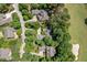 Aerial view of homes in a neighborhood near golf course surrounded by mature trees at 27425 Walker, Chapel Hill, NC 27517