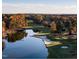 Beautiful aerial shot of a golf course with a pond and fall foliage at 27425 Walker, Chapel Hill, NC 27517