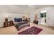 Bedroom featuring a ceiling fan, large window, and doorway to bathroom at 27425 Walker, Chapel Hill, NC 27517